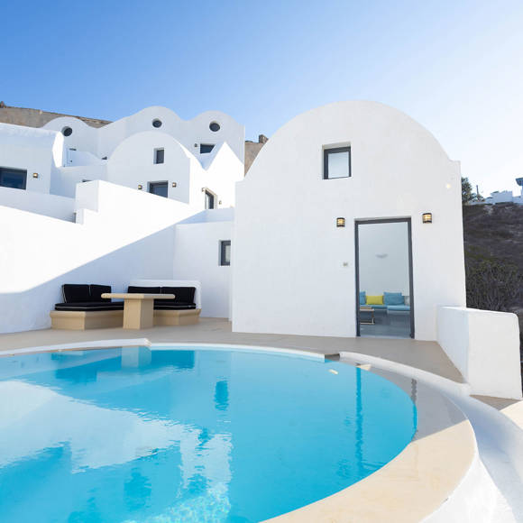 Grand Ambassador Santorini Serenity Two Bedroom Suite exterior with private pool, Cycladic architecture, and outdoor lounge area