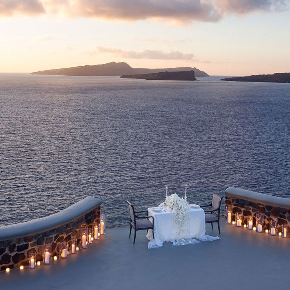 Grand Ambassador wedding venue romantic candlelit table overlooking the sea at sunset